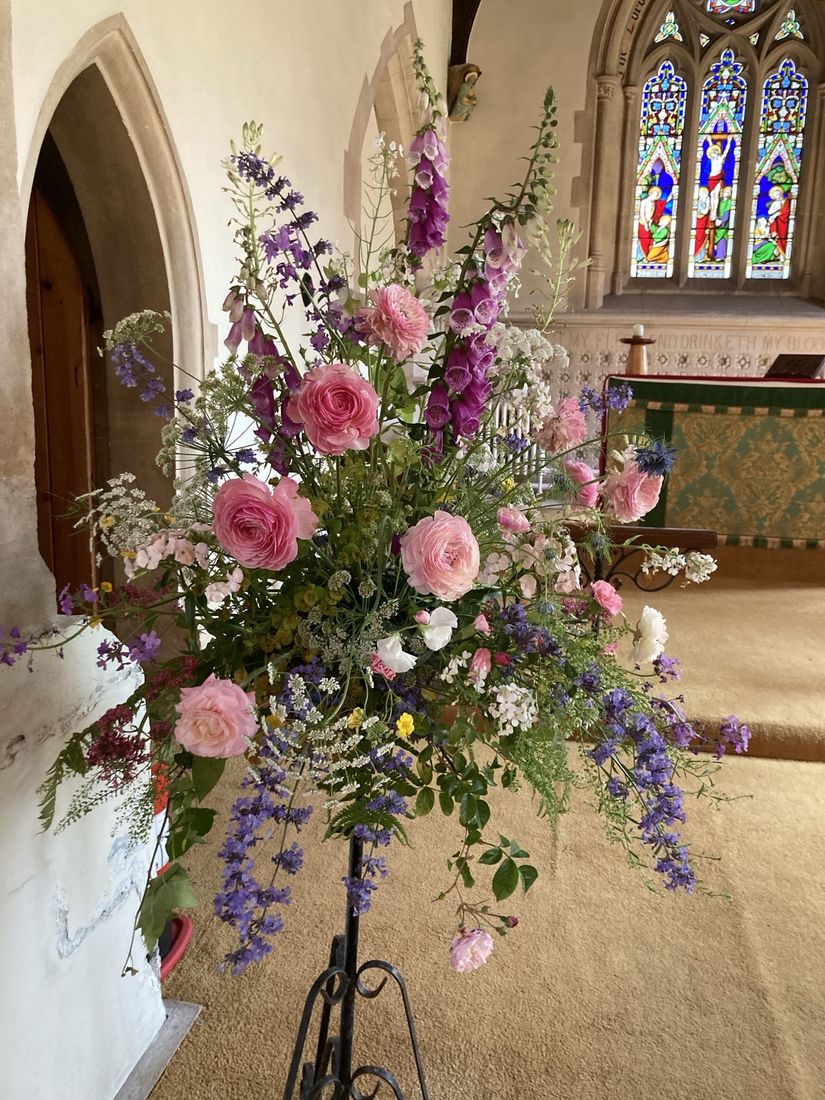 A large fresh flower arrangement in a church