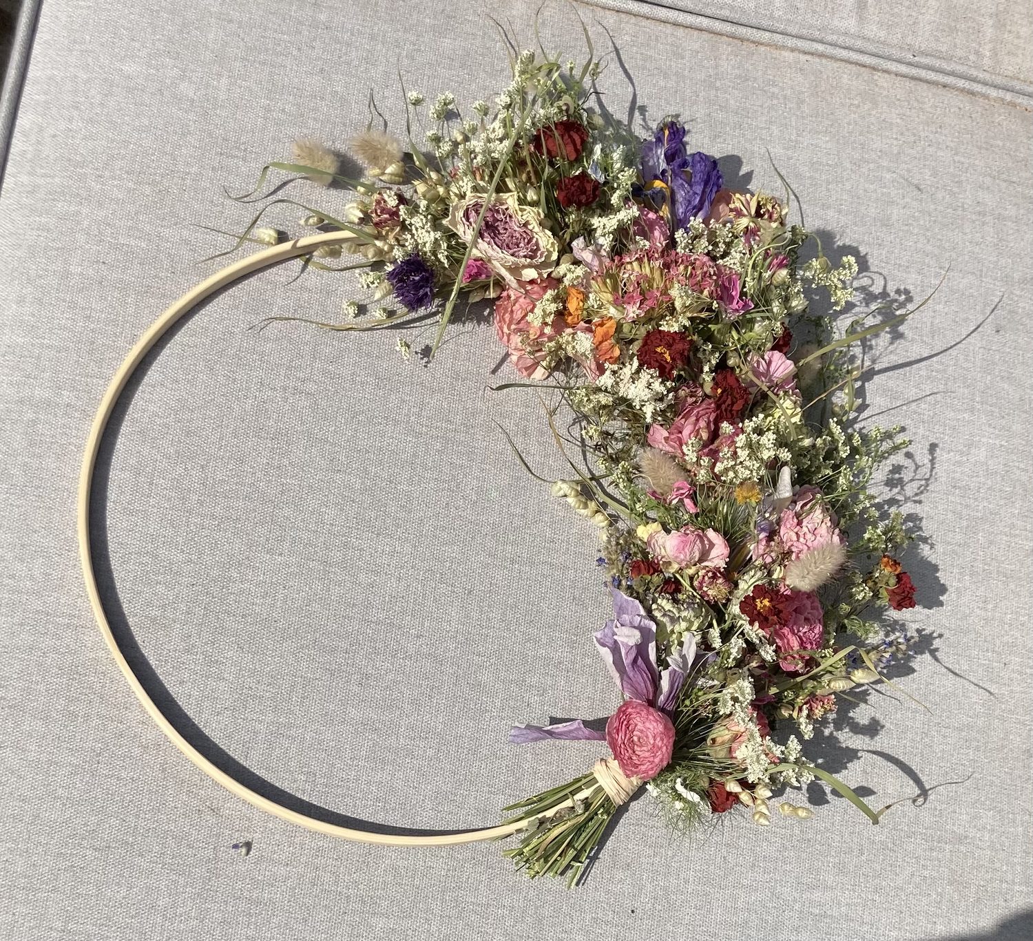 A finished dried flower hoop wreath made at a workshop